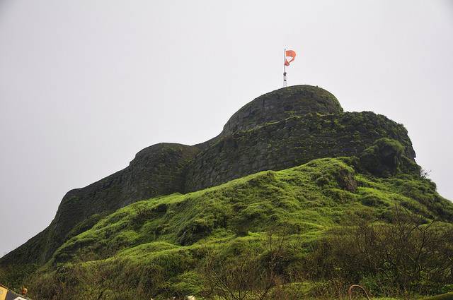 Green hilltop fort landscape near Mandangad