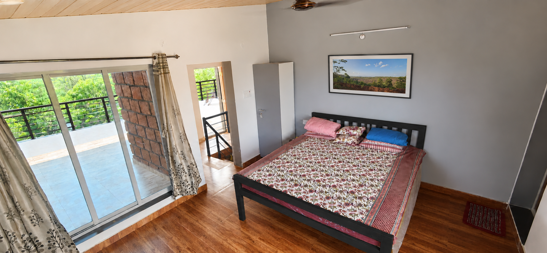 Comfortable bedroom opening onto a private balcony