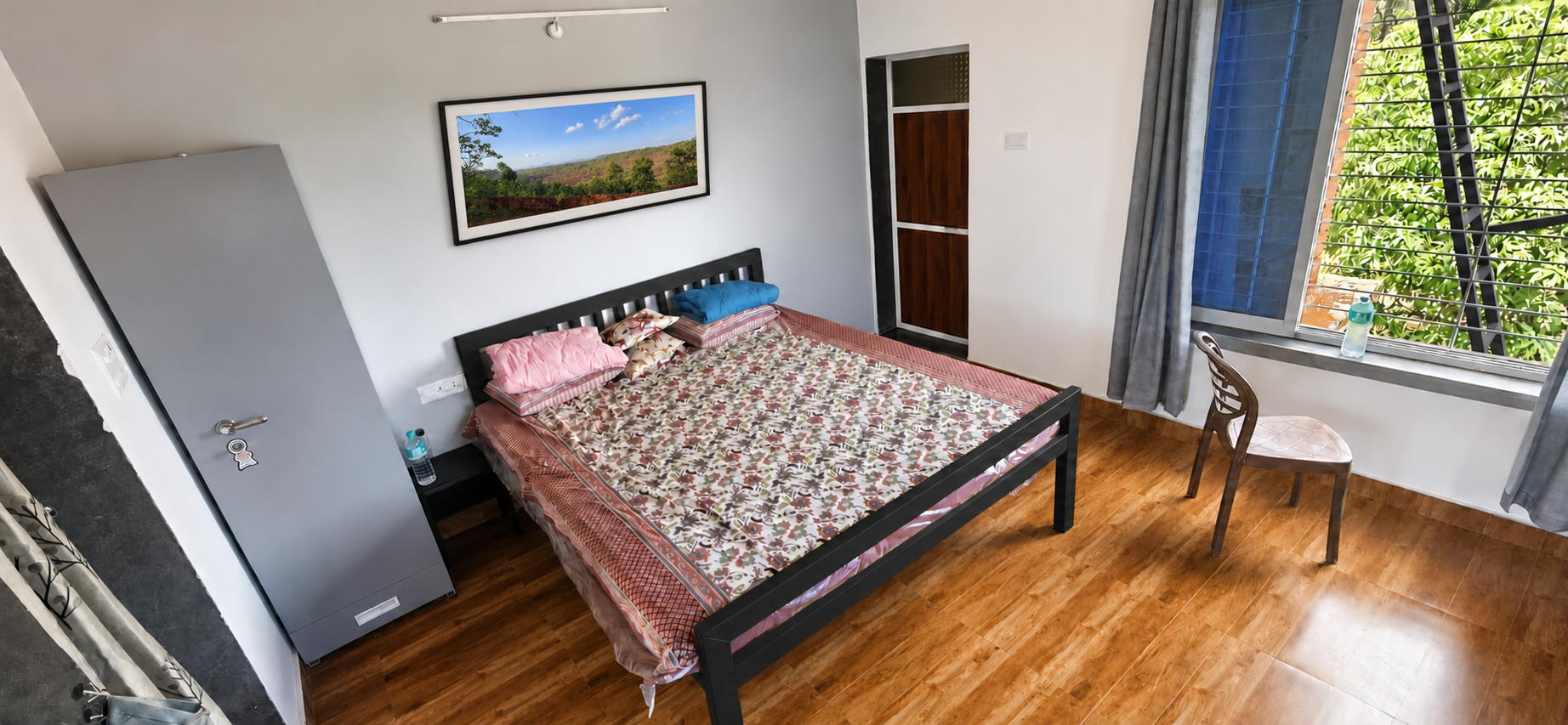 Private bedroom with a large window overlooking the mango trees