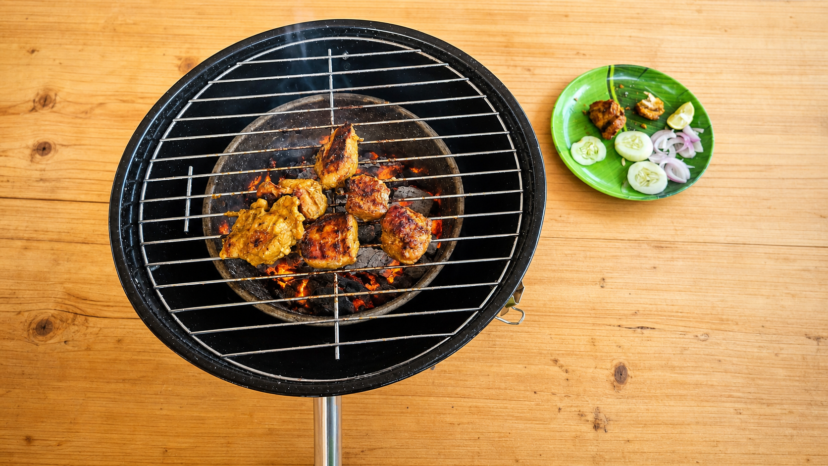 Freshly marinated food cooking over a charcoal barbecue
